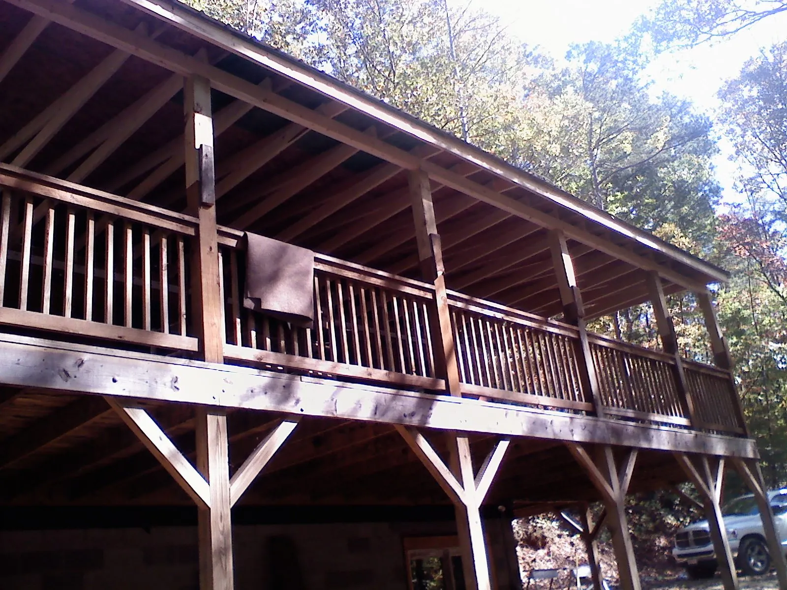 Timber framing under a new elevated porch and deck — Roof Leak Repair in Big Bear City by Roofing Brothers